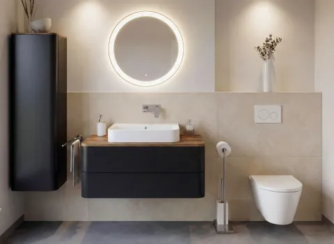 Badezimmer mit haengendem Aufsatz-Waschtisch, ovalem Leuchtspiegel und wandhaengendem Hochschrank.