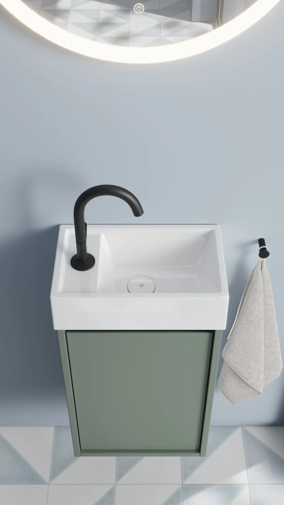 Kleiner Waschtisch für das Gäste-WC aus der Devio-Kollektion von burgbad in der Farbe rauchgrün.